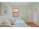 Bedroom featuring a trundle bed, neutral colors, plus a window, and laminate wood flooring at 7325 Skybird Rd # 399, Bradenton, FL 34209