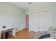 Well-lit bedroom includes wood-look floors, a spacious closet, and a convenient workstation, perfect for a functional space at 7325 Skybird Rd # 399, Bradenton, FL 34209
