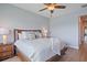 Light and airy bedroom featuring a comfortable bed with soft bedding, wood floors, plus side tables with lamps at 7325 Skybird Rd # 399, Bradenton, FL 34209