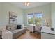 Cozy bedroom featuring a daybed, desk, and a bright window with natural light and outside view at 7325 Skybird Rd # 399, Bradenton, FL 34209