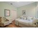 Cozy bedroom with a trundle bed, a side chair, and laminate wood flooring at 7325 Skybird Rd # 399, Bradenton, FL 34209