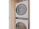 Laundry room with stacked LG washer and dryer, maximizing space and offering modern convenience at 7325 Skybird Rd # 399, Bradenton, FL 34209