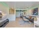 Open floor plan with sleek ceilings, tile flooring, and a gray couch that enhances the space at 7325 Skybird Rd # 399, Bradenton, FL 34209