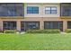 A view of the screened in patios with lush green grass and beautiful landscaping at 7325 Skybird Rd # 399, Bradenton, FL 34209