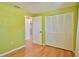 Bedroom featuring hardwood floors, a closet, and doorway at 7355 Cass Cir, Sarasota, FL 34231