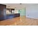 Modern kitchen and breakfast area with stainless steel appliances and wooden floors at 7355 Cass Cir, Sarasota, FL 34231