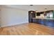 Modern kitchen and breakfast area with stainless steel appliances and wooden floors at 7355 Cass Cir, Sarasota, FL 34231
