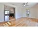 Spacious living room with hardwood floors and large windows for natural light at 7355 Cass Cir, Sarasota, FL 34231