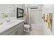 Bathroom featuring neutral tones, a tub with shower, and a single vanity with ample lighting at 7542 Windy Hill Cv, Bradenton, FL 34202