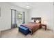 Bedroom featuring a ceiling fan, a side table with lamp, and a window at 7542 Windy Hill Cv, Bradenton, FL 34202