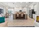 Eat-in kitchen with granite counters, stainless appliances, and a center island with barstool seating at 7542 Windy Hill Cv, Bradenton, FL 34202