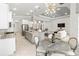 Open floor plan living space with stainless appliances and plenty of natural light at 7542 Windy Hill Cv, Bradenton, FL 34202