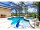 Relaxing pool and spa with a view of the lush landscaping and golf course at 7542 Windy Hill Cv, Bradenton, FL 34202
