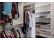 Organized walk-in closet with ample hanging space, shelves, and storage solutions to maximize storage capacity at 8291 Varenna Dr, Sarasota, FL 34231