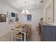 Comfortable dining room showcasing modern decor, chandelier lighting and stylish furniture at 8291 Varenna Dr, Sarasota, FL 34231