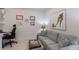 Cozy home office nook with a comfortable sofa, providing a relaxing workspace at 8291 Varenna Dr, Sarasota, FL 34231
