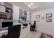 Well-lit home office with built-in shelving and desk space, perfect for remote work at 8291 Varenna Dr, Sarasota, FL 34231