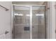 Tiled shower featuring a glass enclosure, a built-in bench, and modern fixtures, creating a spa-like experience at 8291 Varenna Dr, Sarasota, FL 34231