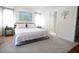 Bright bedroom with white shiplap wall, decorative wall art, and comfortable furniture at 831 Palmetto Ne Dr, Port Charlotte, FL 33952