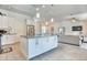 Open concept kitchen with a large island, modern appliances, and seamless flow to the living area at 831 Palmetto Ne Dr, Port Charlotte, FL 33952