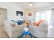 Cozy living area with comfortable seating, sliding doors, and a serene atmosphere at 831 Palmetto Ne Dr, Port Charlotte, FL 33952