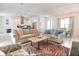 Inviting living area flowing to the kitchen, featuring contemporary furnishings and bright decor at 831 Palmetto Ne Dr, Port Charlotte, FL 33952