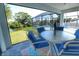 Inviting screened patio featuring comfortable seating and a view of the pool at 831 Palmetto Ne Dr, Port Charlotte, FL 33952