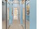 Hallway with mirrored closet doors leading to the main bathroom at 866 Oak Briar Ln, Osprey, FL 34229