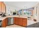 Open kitchen featuring stainless steel appliances, a breakfast bar, and seamless connection to the living area at 866 Oak Briar Ln, Osprey, FL 34229