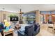 Open-concept living area with view of the pool, neutral decor, and comfortable seating at 866 Oak Briar Ln, Osprey, FL 34229