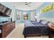 Comfortable main bedroom with blue walls, bay window and large dresser at 866 Oak Briar Ln, Osprey, FL 34229