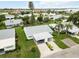Aerial view of a neighborhood with well-maintained lawns, mature trees, and carports at 9412 Concord Cir, Bradenton, FL 34210