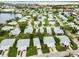Aerial view of a waterfront community featuring a mix of residential homes, ponds and landscaping at 9412 Concord Cir, Bradenton, FL 34210