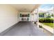 Welcoming front porch with seating area, teal shutters, and a neutral color scheme creating curb appeal at 9412 Concord Cir, Bradenton, FL 34210