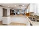 Bright kitchen featuring granite countertops and views into the adjacent dining and living areas at 9412 Concord Cir, Bradenton, FL 34210