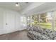 Bright sunroom with many windows, creating a relaxing space with ample natural light and views of the outdoors at 9412 Concord Cir, Bradenton, FL 34210