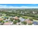 Panoramic aerial view of a charming residential area with well-spaced homes, mature trees, and a harmonious community feel at 1126 Barclay Wood Dr, Ruskin, FL 33570