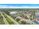 Beautiful aerial view of a community, showcasing a scenic lake, lush greenery, and well-spaced homes at 1126 Barclay Wood Dr, Ruskin, FL 33570