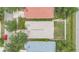 Aerial view of a home showing the roof, small yard and surrounding trees at 1126 Barclay Wood Dr, Ruskin, FL 33570