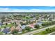 Scenic aerial view highlights a suburban neighborhood featuring tree-lined streets, manicured lawns, and diverse architectural styles at 1126 Barclay Wood Dr, Ruskin, FL 33570