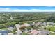 Aerial view shows neighborhood with beautiful homes, manicured lawns, and tree-lined streets, creating a welcoming atmosphere at 1126 Barclay Wood Dr, Ruskin, FL 33570