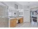 Bathroom with a double vanity, large mirror, and a glass-enclosed shower at 1126 Barclay Wood Dr, Ruskin, FL 33570