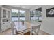 Dining room with a charming corner cabinet and a large window view at 1126 Barclay Wood Dr, Ruskin, FL 33570