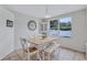 Cozy dining area with a large window offering natural light at 1126 Barclay Wood Dr, Ruskin, FL 33570