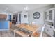 Dining area with large table, seating for six and view to the kitchen at 1126 Barclay Wood Dr, Ruskin, FL 33570