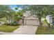 Charming single-story home with a two-car garage and a well-manicured front yard at 1126 Barclay Wood Dr, Ruskin, FL 33570