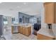 Well-lit kitchen with stainless steel appliances, ample countertop space, and open to living area at 1126 Barclay Wood Dr, Ruskin, FL 33570