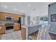 Bright kitchen featuring stainless steel appliances, bar seating, and lots of natural light at 1126 Barclay Wood Dr, Ruskin, FL 33570