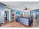 Living room with wood floors flowing into other areas at 1126 Barclay Wood Dr, Ruskin, FL 33570