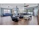 Spacious living room with wood floors, vaulted ceiling, and open concept design at 1126 Barclay Wood Dr, Ruskin, FL 33570